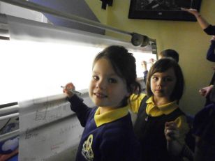 Holy Trinity Pupils sign the peace scroll